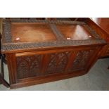 A GOTHIC STYLE CARVED DARK WOOD COFFER/ BLANKET BOX