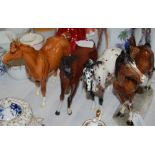 A GROUP OF FOUR CERAMIC HORSE FIGURES, THREE BY BESWICK AND ONE BY KATZHUTTE