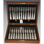 A CASED SET OF TWELVE ELECTROPLATED AND MOTHER OF PEARL HANDLED FRUIT KNIVES AND FORKS