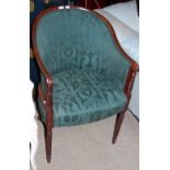 A GREEN UPHOLSTERED MAHOGANY TUB CHAIR ON TAPERED CYLINDRICAL SUPPORTS WITH REEDED DETAIL