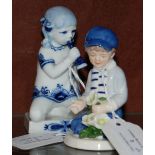 A ROYAL COPENHAGEN FIGURE 'OLIVER 2008', TOGETHER WITH ANOTHER ROYAL COPENHAGEN FIGURE OF A KNEELING