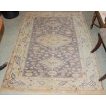 A PERSIAN RUG, THE RECTANGULAR FIELD DECORATED WITH THREE LOZENGE SHAPED MEDALLIONS, STYLISED FLOWER