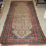 AN ANTIQUE PERSIAN RUG, THE RECTANGULAR FIELD DECORATED WITH INTERLACED DESIGN OF STYLISED FLOWERS