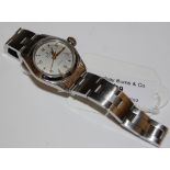 A VINTAGE LADIES ROLEX OYSTER PRECISION WRISTWATCH, THE CIRCULAR DIAL WITH YELLOW METAL ARABIC AND