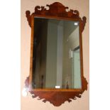 A GEORGIAN STYLE FRET-CUT RECTANGULAR WALL MIRROR