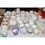 A COLLECTION OF VICTORIAN AND LATER MOUSTACHE CUPS, SOME WITH SAUCERS