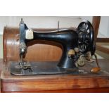 A CASED VINTAGE SINGER SEWING MACHINE WITH PLAQUE '11801825'