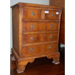 A MINIATURE REPRODUCTION YEW WOOD CHEST OF TWO SHORT OVER THREE DRAWERS, TOGETHER WITH A 19TH