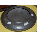 AN ANTIQUE PEWTER BOWL OF FLATTENED CIRCULAR FORM