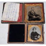 TWO LEATHER-BOUND PORTRAIT PHOTOGRAPHS, EACH WITH GILDED SLIPS