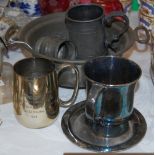 A GROUP OF MIXED METAL WARES COMPRISING A PEWTER TANKARD, A PEWTER MEASURE, A TWIN-HANDLED PEWTER