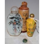 THREE ASSORTED CHINESE SNUFF BOTTLES TO INCLUDE CARVED WOODEN EXAMPLE DECORATED WITH EROTIC