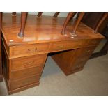 A COLONIAL STYLE HARDWOOD AND BRASS LINED PEDESTAL DESK, THE RECTANGULAR TOP ABOVE THREE FRIEZE