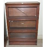 A VINTAGE GLOBE WERNICKE THREE SECTIONAL STACKING BOOKCASE (LACKING ONE GLASS PANEL)