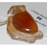 A CARVED AGATE/ HARD STONE PEACH, POSSIBLY CHINESE, 4CM LONG