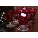A SET OF EIGHT CRANBERRY AND CLEAR GLASS CUSTARD CUPS