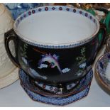 A LATE 19TH/ EARLY 20TH CENTURY POTTERY TWIN-HANDLED JARDINIERE, THE BLACK GROUND DECORATED WITH