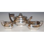 A SHEFFIELD SILVER THREE-PIECE TEA SET, MAKERS MARK 'WALKER AND HALL', ENGRAVED WITH THE INITIAL '