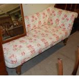 A 19TH CENTURY MAHOGANY CHAISE LONGUE WITH FLORAL UPHOLSTERY RAISED ON FOUR HEXAGONAL TAPERED