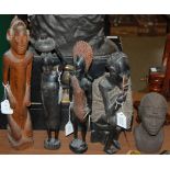 TRIBAL ART - A GROUP OF FOUR ASSORTED CARVED WOODEN FIGURES TOGETHER WITH A CERAMIC BUST