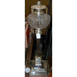 AN ELECTROPLATED CORINTHIAN COLUMN PARAFFIN BURNING OIL LAMP CONVERTED TO TABLE LAMP AND SHADE, WITH