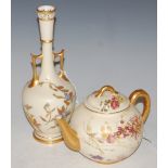 A ROYAL WORCESTER IVORY GROUND TWIN HANDLED BOTTLE VASE WITH SCATTERED FOLIATE SPRAY DECORATION