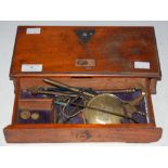 A 19TH CENTURY MAHOGANY CASED TRAVELLING SCALE SET, COLLAPSING DOWN CONTAINED WITHIN A SINGLE FRIEZE