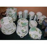 A VILLEROY AND BOCH PART DINNER SET WITH GREEN AND TEAL FLORAL DETAILING