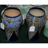 A PAIR OF ROYAL DOULTON STONEWARE VASES DECORATED WITH STYLISED FLOWERS, ONE SIGNED ON THE UNDERSIDE