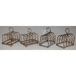 A PAIR OF SHEFFIELD SILVER FIVE BAR TOAST RACKS, TOGETHER WITH A PAIR OF BIRMINGHAM SILVER FIVE