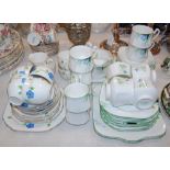 A VINTAGE HEATHCOTE CHINA ART DECO STYLE PART TEA SET, TOGETHER WITH A BLUE FLORAL DECORATED HAND