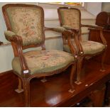A PAIR OF LATE 19TH CENTURY FRENCH STAINED BEECH FAUTEUIL ARMCHAIRS WITH FLORAL DECORATED NEEDLEWORK