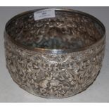 AN INDIAN/ BURMESE WHITE METAL BOWL EMBOSSED WITH ANIMALS AND SCROLLING FOLIAGE, 12.1 TROY OZ