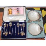 A CASED SET OF SIX SHEFFIELD SILVER COFFEE SPOONS AND TONGS, TOGETHER WITH A CASED PAIR OF