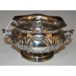 A SHEFFIELD SILVER TWIN-HANDLED HEXAGONAL SHAPED BOWL WITH EMBOSSED FLOWER AND C-SCROLL