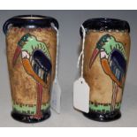 A PAIR OF EARLY 20TH CENTURY AUSTRIAN AMPHORA TWIN-HANDLED POTTERY VASES, DECORATED WITH BIRDS