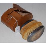 A VINTAGE PAIR OF BIRMINGHAM SILVER BACKED GENTS HAIRBRUSHES IN ORIGINAL LEATHER CASE
