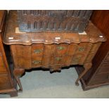 AN EARLY 20TH CENTURY WALNUT CHEST IN THE ANTIQUE STYLE WITH TWO LONG DRAWERS ON SHORT CABRIOLE