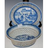 A CHINESE BLUE AND WHITE PORCELAIN RETICULATED OVAL-SHAPED BASKET AND STAND