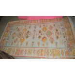 A KILIM TYPE FLATWEAVE RUG, THE RECTANGULAR FIELD DECORATED WITH STYLISED FLOWERS, FISH AND BIRDS,