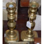 A PAIR OF BRASS EJECTOR CANDLESTICKS