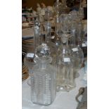 A GROUP OF SEVEN GLASS DECANTERS OF VARIOUS STYLES AND SIZES