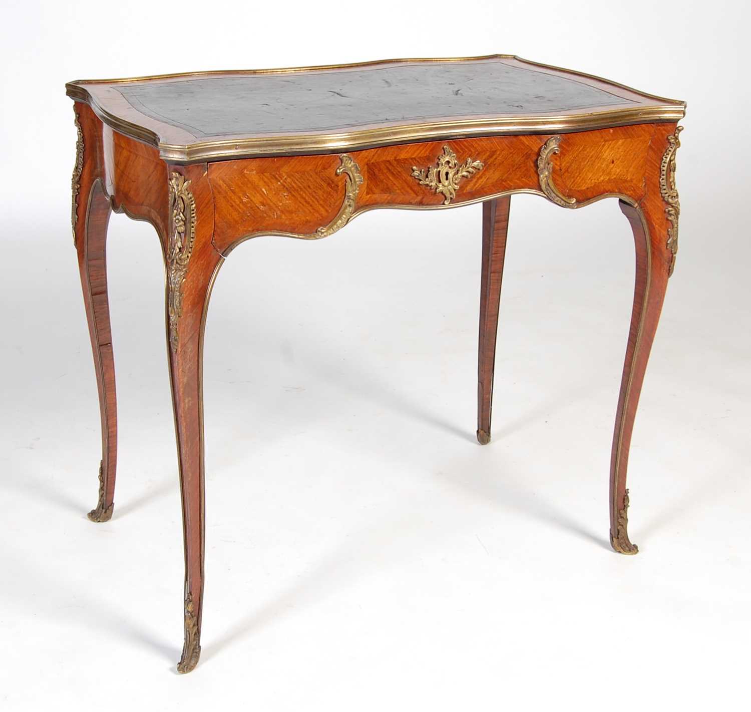 A late 19th/ early 20th century rosewood and gilt metal mounted writing table, the rectangular top