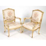 A pair of giltwood fauteuil, early 20th century, with floral upholstered back, arms and seat, raised