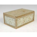 A Chinese green stone and brass rectangular shaped box, 20th century, the cover and sides carved and