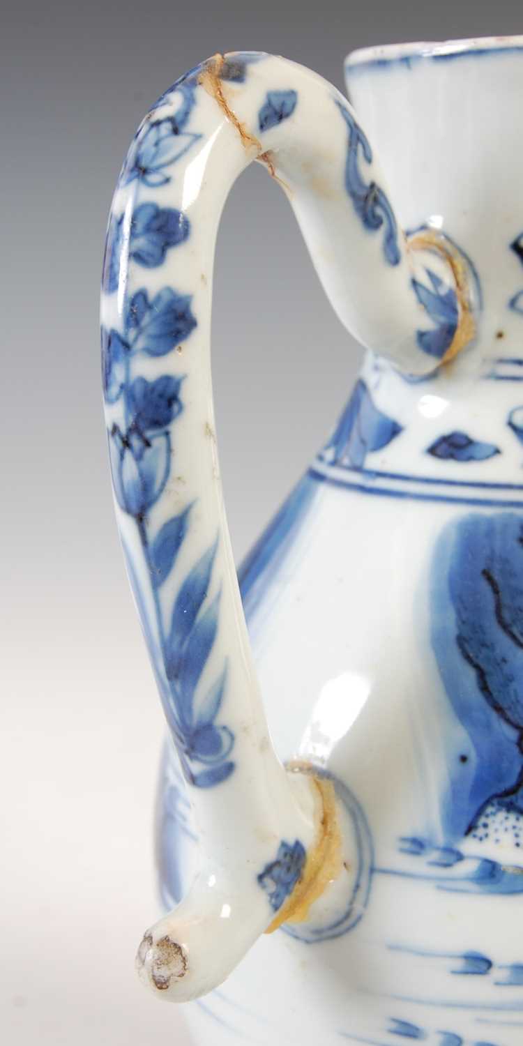 A Chinese porcelain blue and white jug, Qing Dynasty, decorated with three figures in a fenced - Image 3 of 10