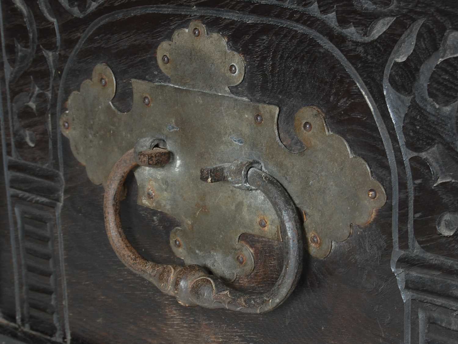 An antique stained oak coffer on integral stand, the hinged cover with two incised figural carved - Image 7 of 13