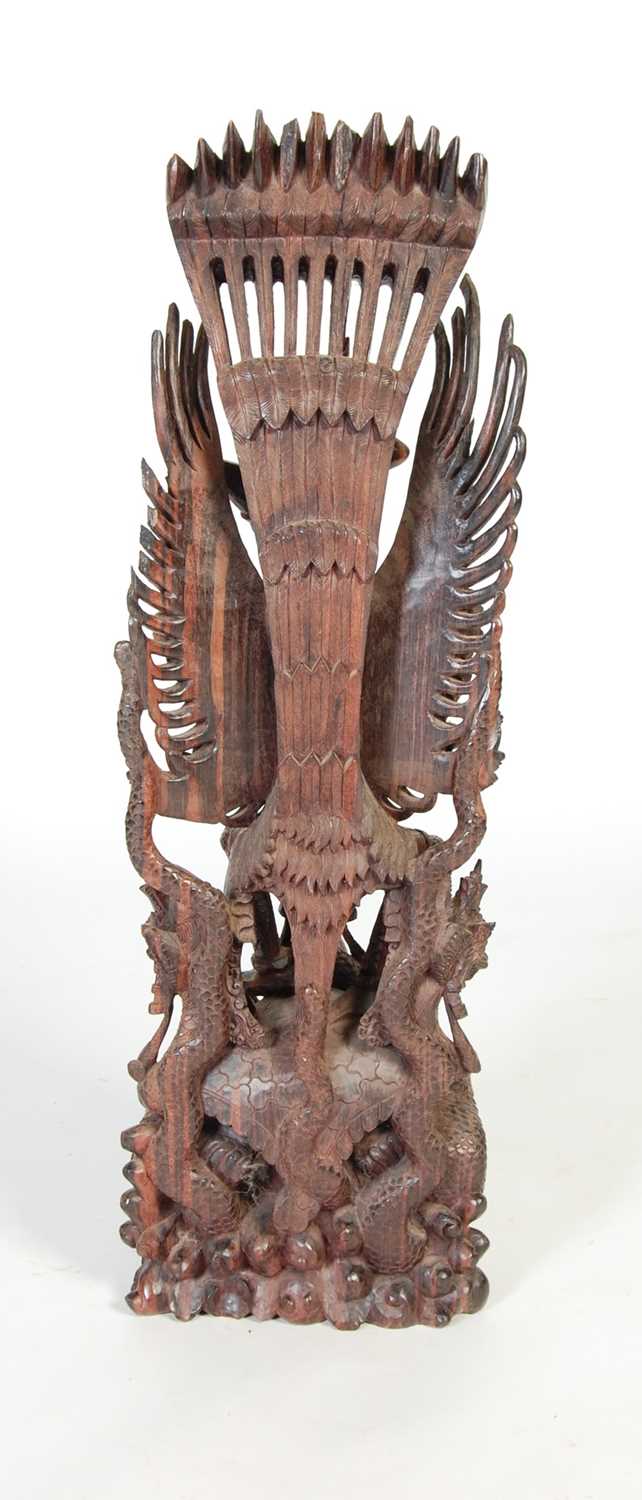 An Indonesian carved hardwood figure of Garuda and dragons, 97.5cm high. - Image 6 of 6