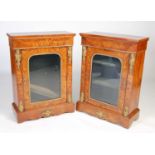 A pair of 19th century walnut, marquetry and gilt metal mounted pier cabinets, the rectangular