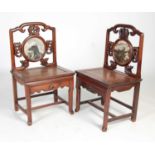 A pair of Chinese dark wood and marble inset side chairs, late 19th/ early 20th century, the upright